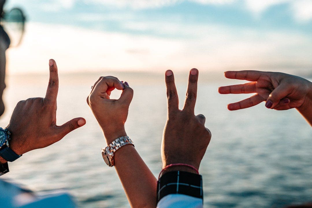 Hands showing the letter LOVE